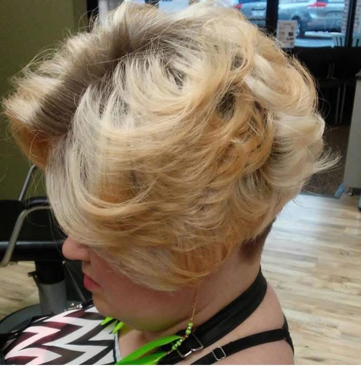 Blonde curly pixie cut, side view