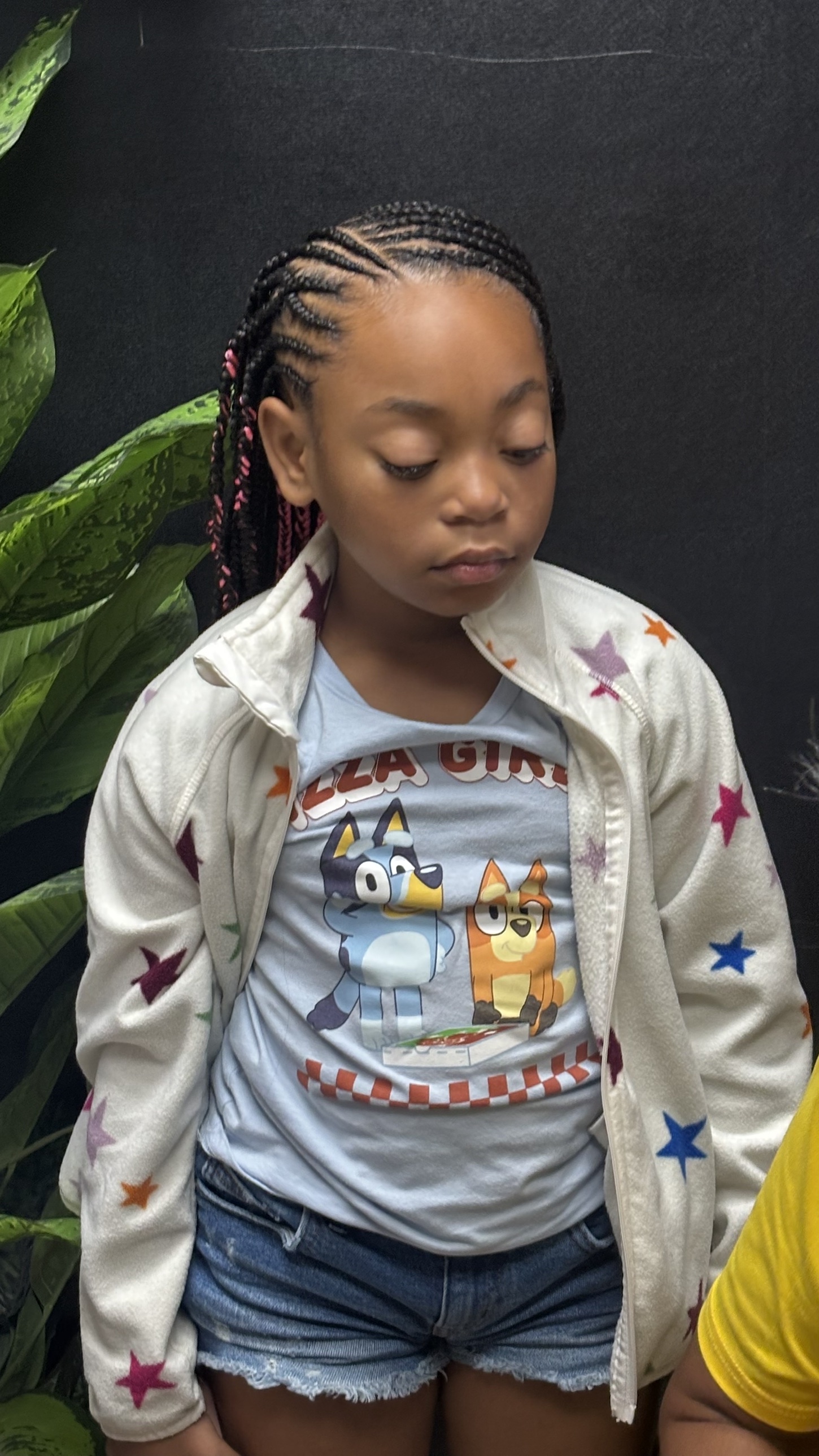 Kid's braids with pink hair strands